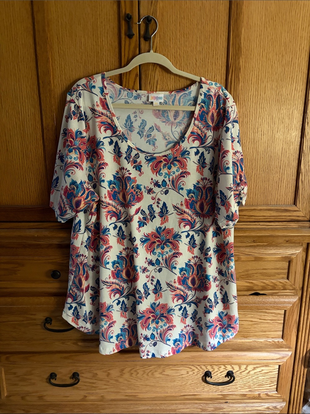 LuLaRoe Cream Tunic with Orange and Teal Floral Paisley Print